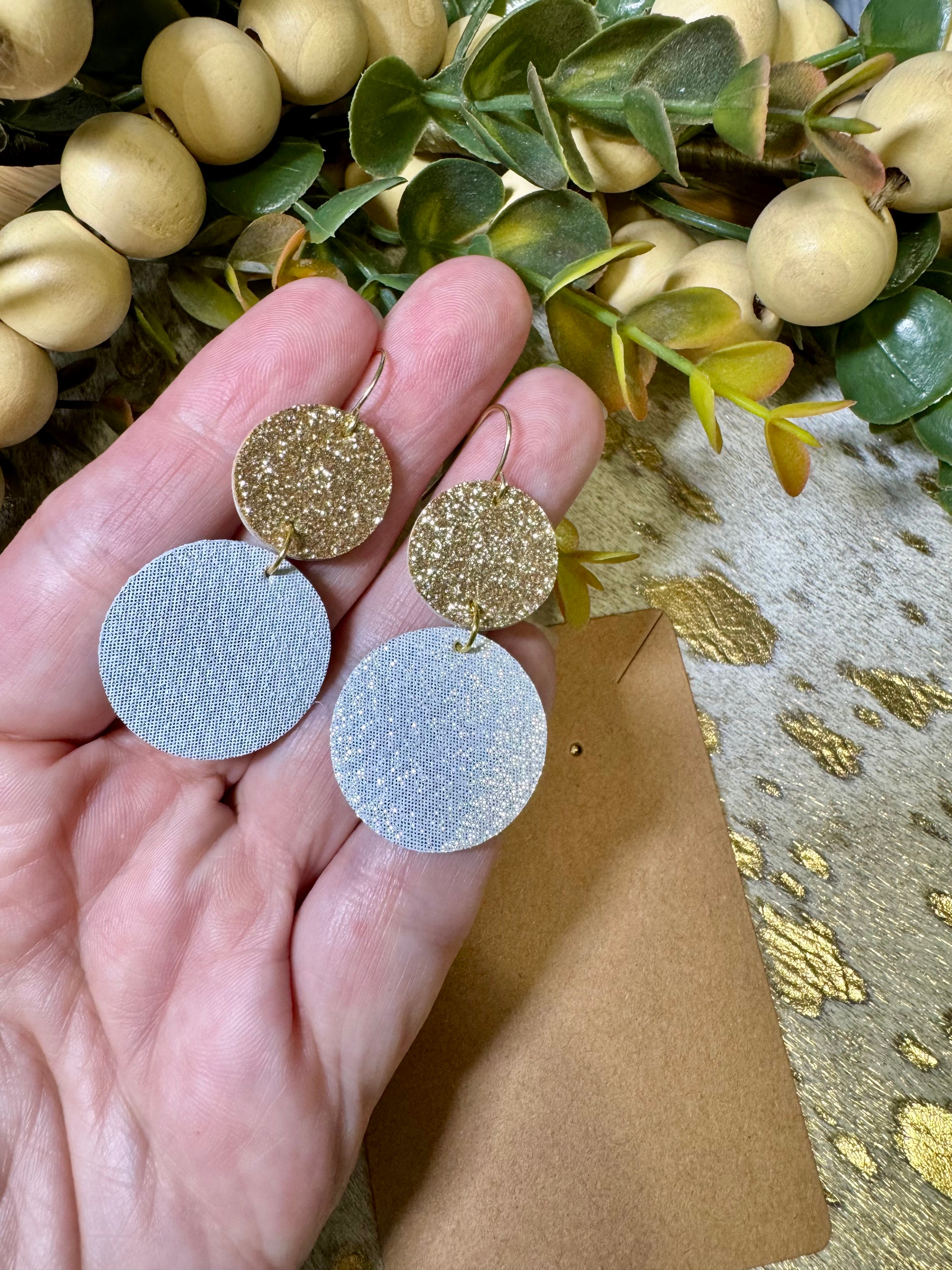 Gold & White leather circle earrings.