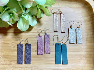 Metallic leather bar earrings.