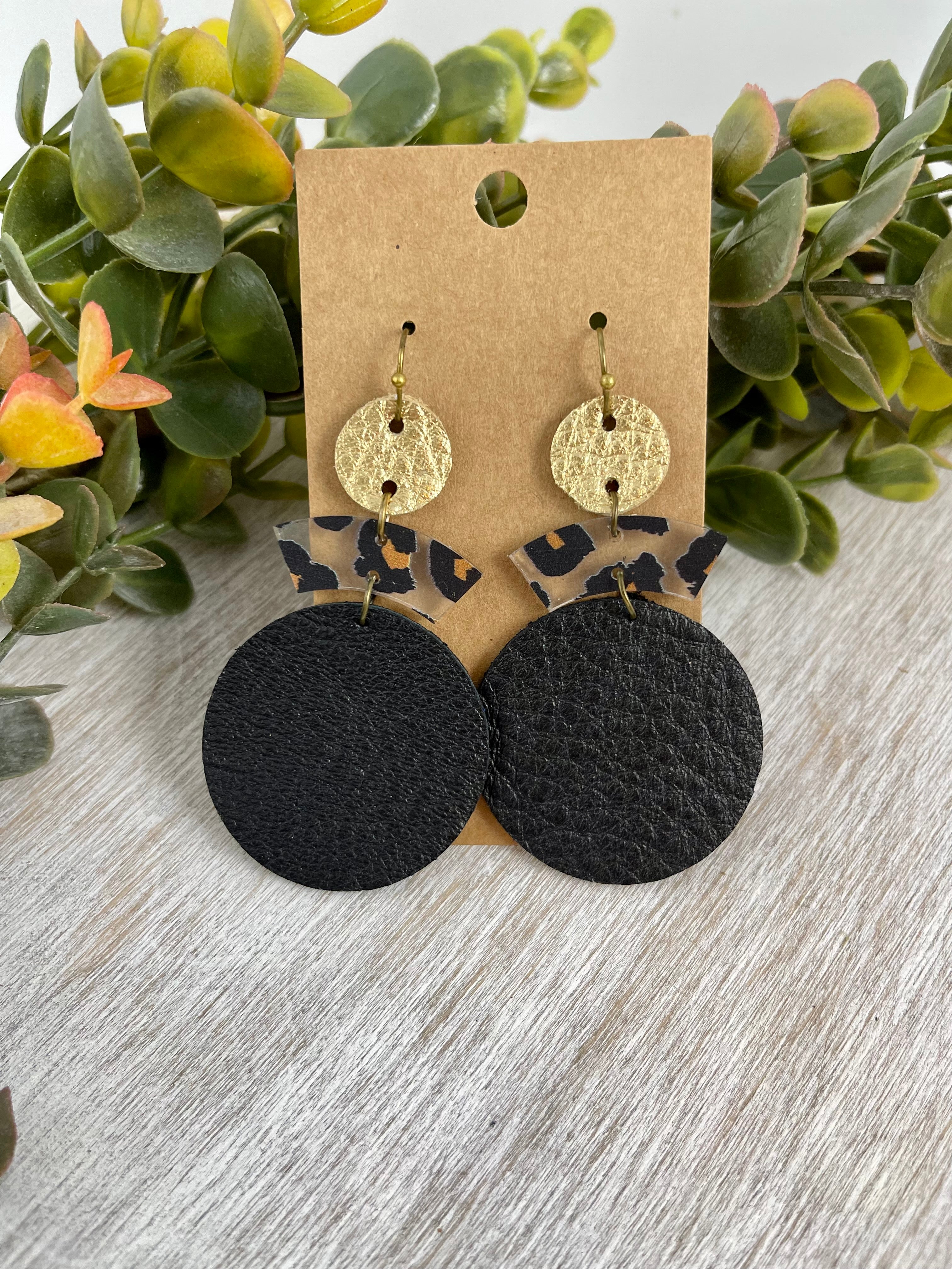 Black and metallic gold leather earrings with leopard print accents. Large earring.