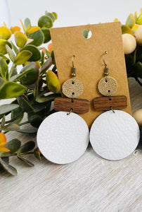 Leather and wood earrings. Leather circle with wood bar accents.