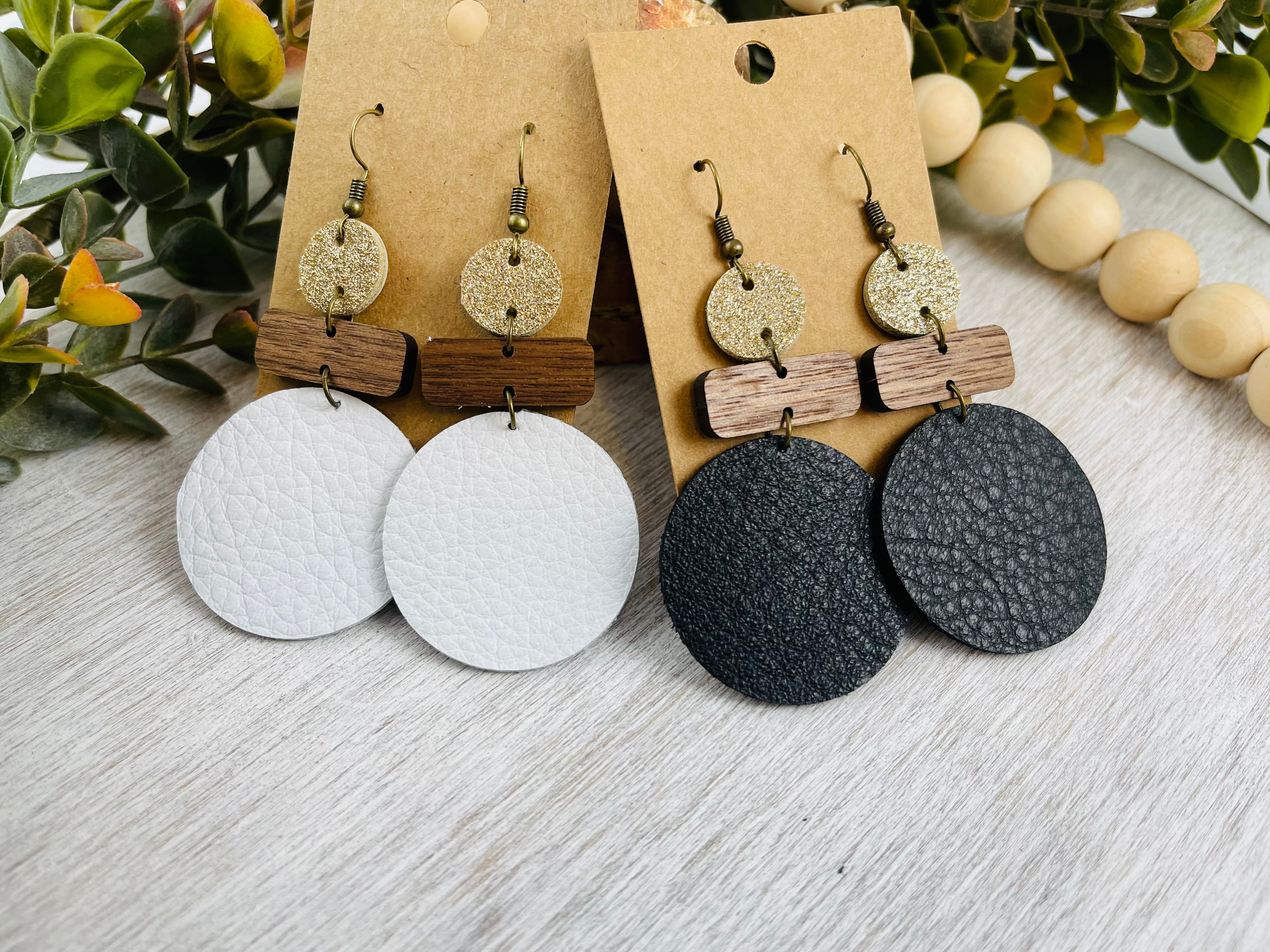 Leather and wood earrings. Leather circle with wood bar accents.