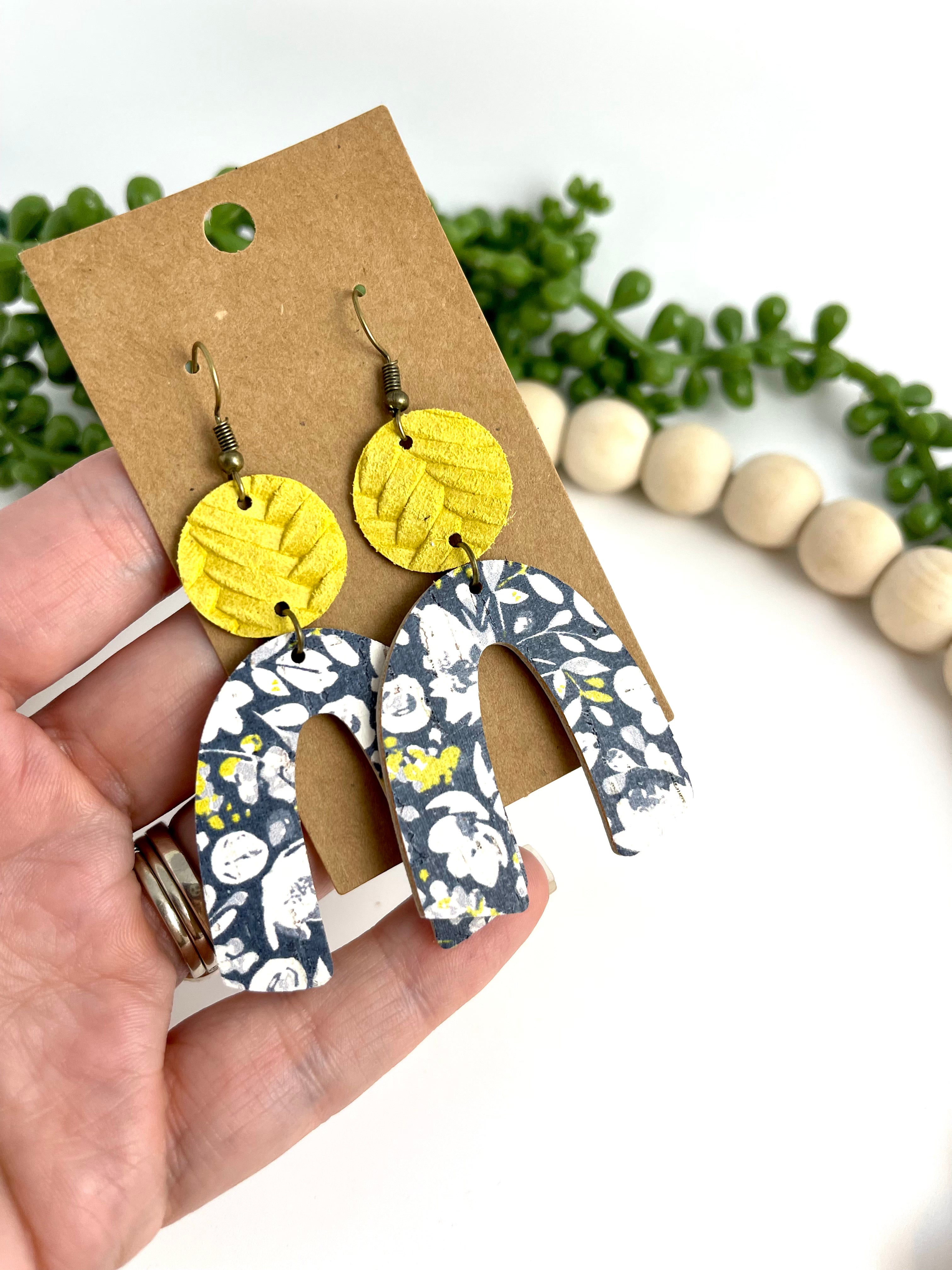 Navy floral arched leather earrings