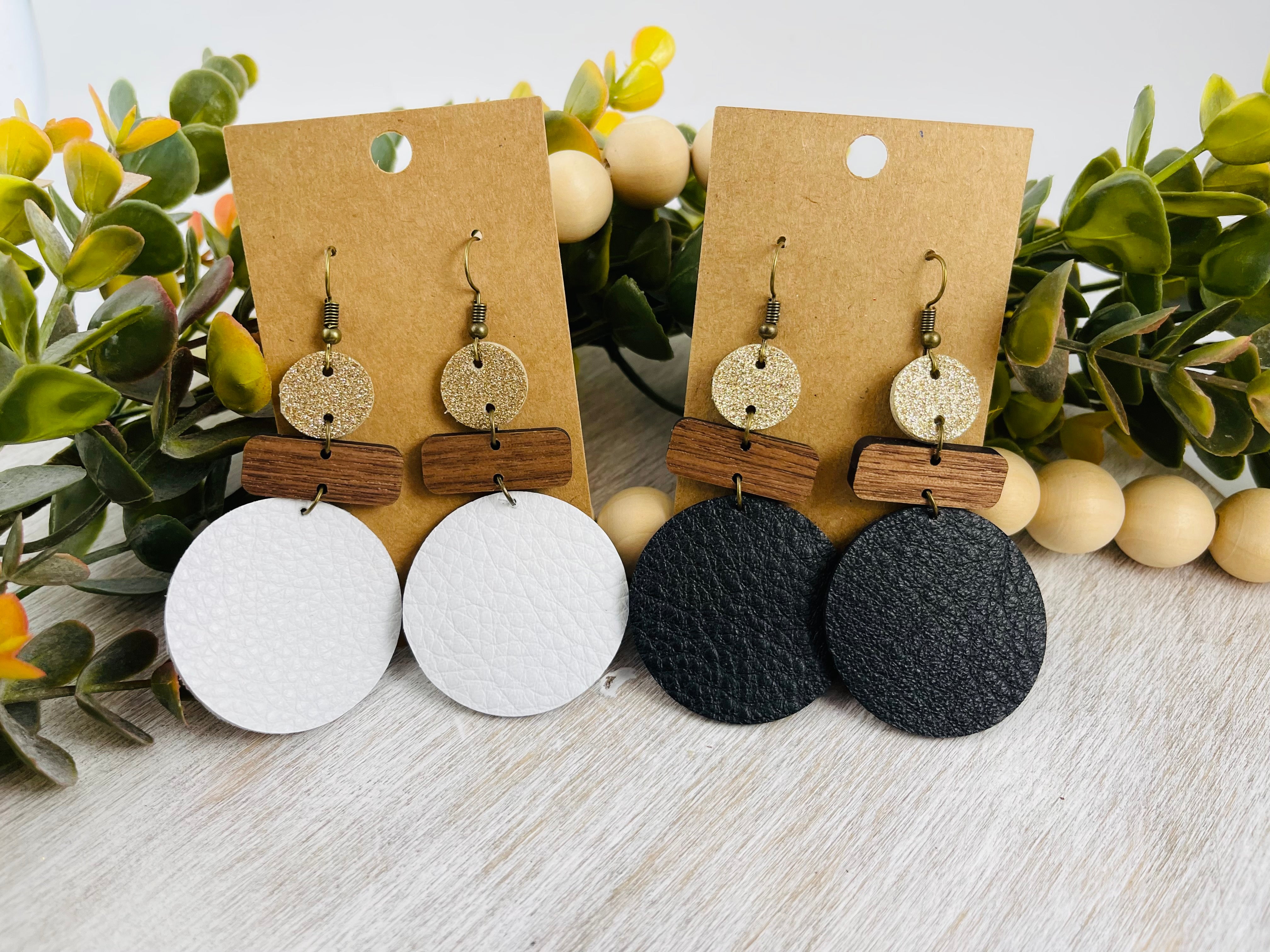 Leather and wood earrings. Leather circle with wood bar accents.