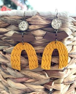 Large arched leather earrings. Gold and mustard.