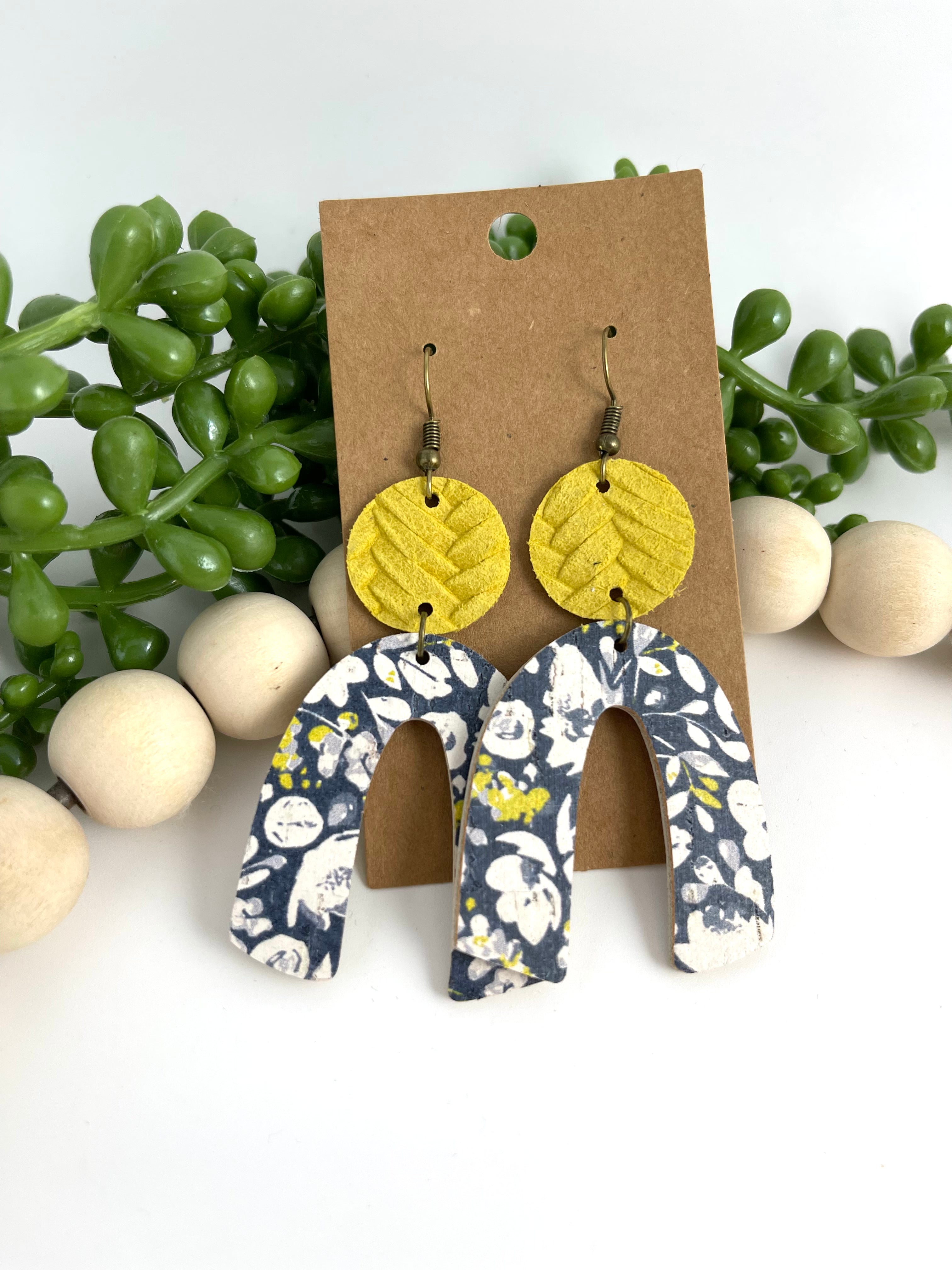 Navy floral arched leather earrings