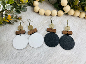 Leather and wood earrings. Leather circle with wood bar accents.